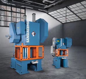 Large and compact Sangiacomo flywheel presses displayed on factory floor