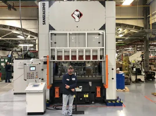 Large Sangiacomo servo mechanical press machine in an industrial setting.